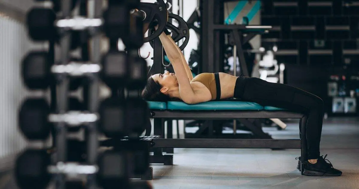 Attractive young woman exercising at the gym