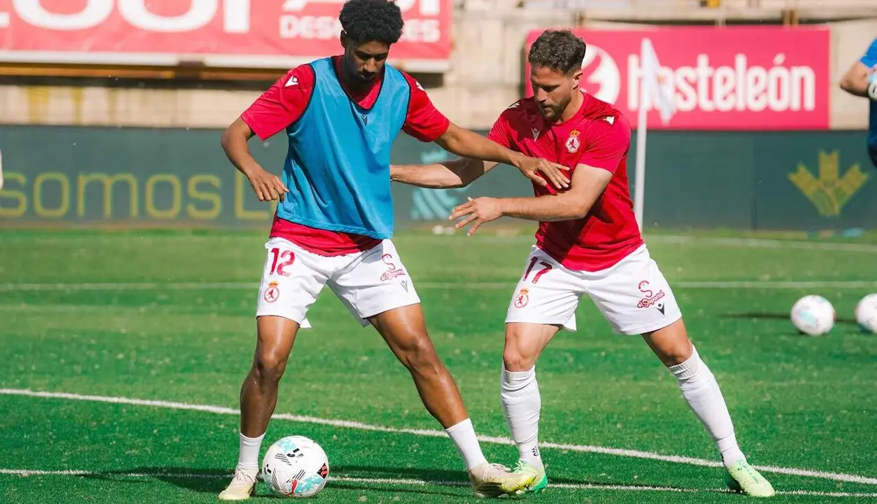 Homam y Calero, durante el calentamiento.