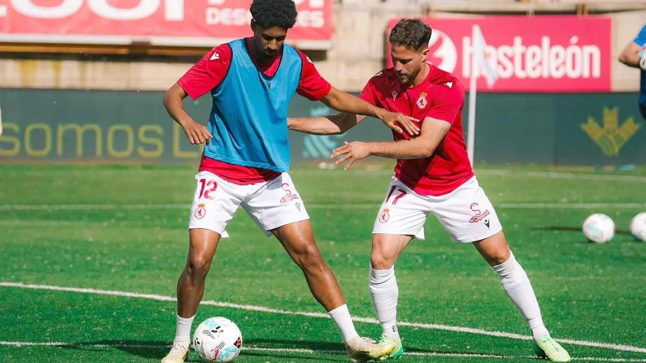 Homam y Calero, durante el calentamiento.