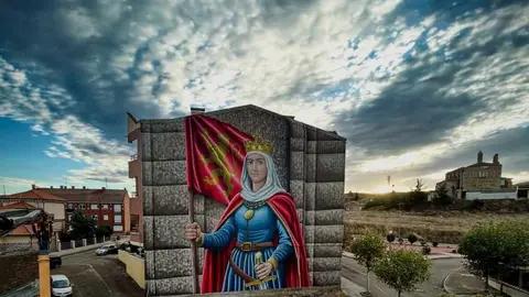 Sahagún rinde homenaje a la reina Urraca con un mural monumental como antesala del 900 aniversario de su muerte
Sahagún rinde homenaje a la reina Urraca con un mural monumental como antesala del 900 aniversario de su muerte. El artista leonés Manuel García Juan firma una obra de gran formato que representa a la primera reina de pleno derecho de España y Europa.